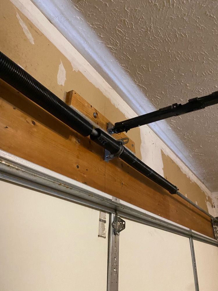 broken torsion spring Garage Door Maintenance garage door repair garage door service garage door spring replacement Garage Door Spring Replacement Bettendorf