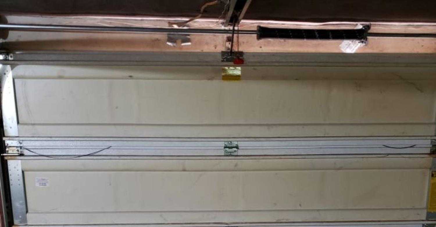 broken torsion spring Garage Door Maintenance garage door repair garage door service garage door spring replacement Garage Spring Replacement East Moline