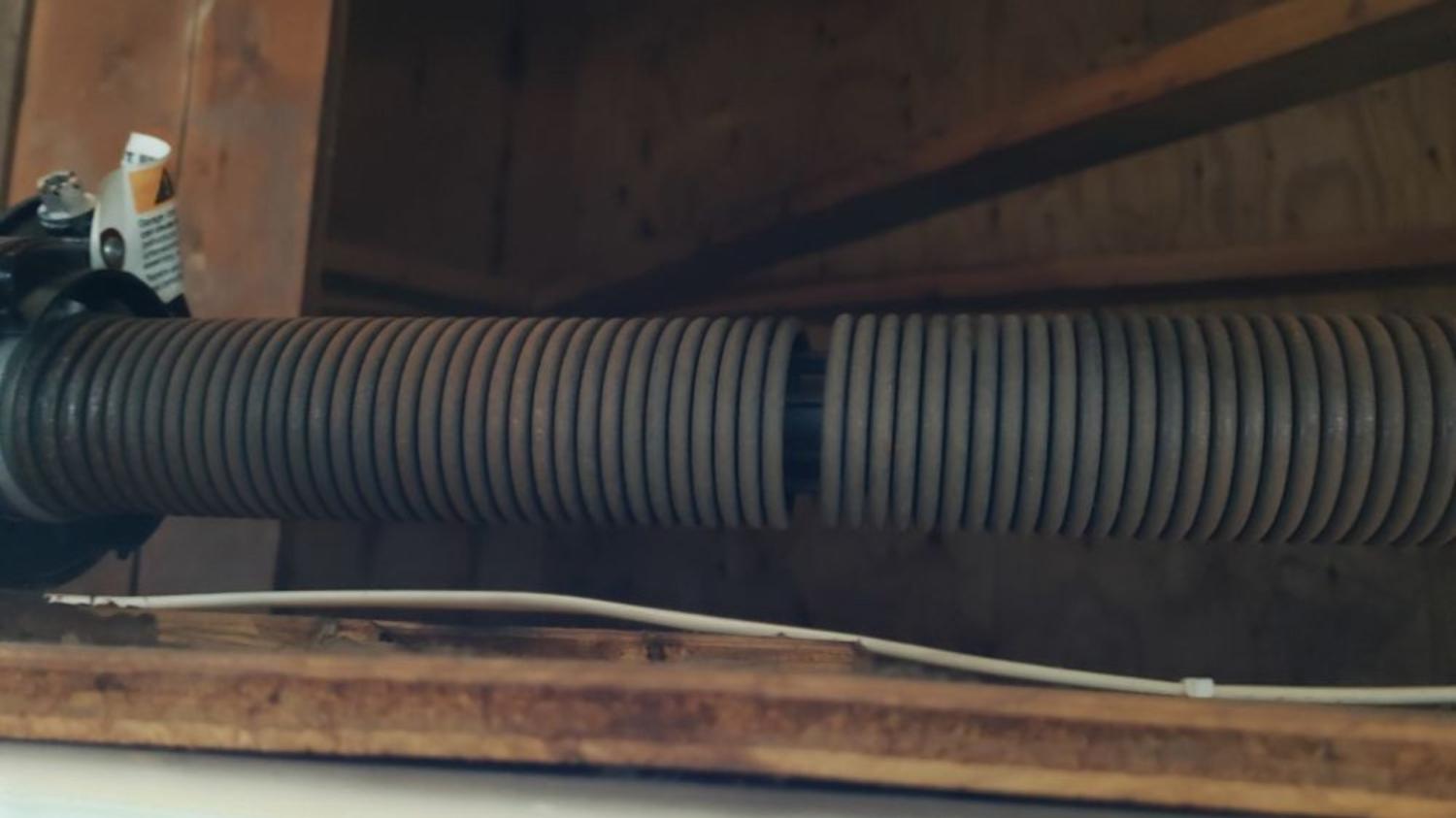 broken torsion spring Garage Door Maintenance garage door repair garage door service garage door spring replacement Residential Garage Door Spring Replacement Bettendorf